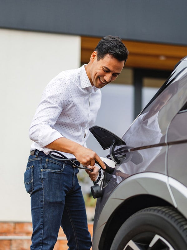 a man standing next to a car
